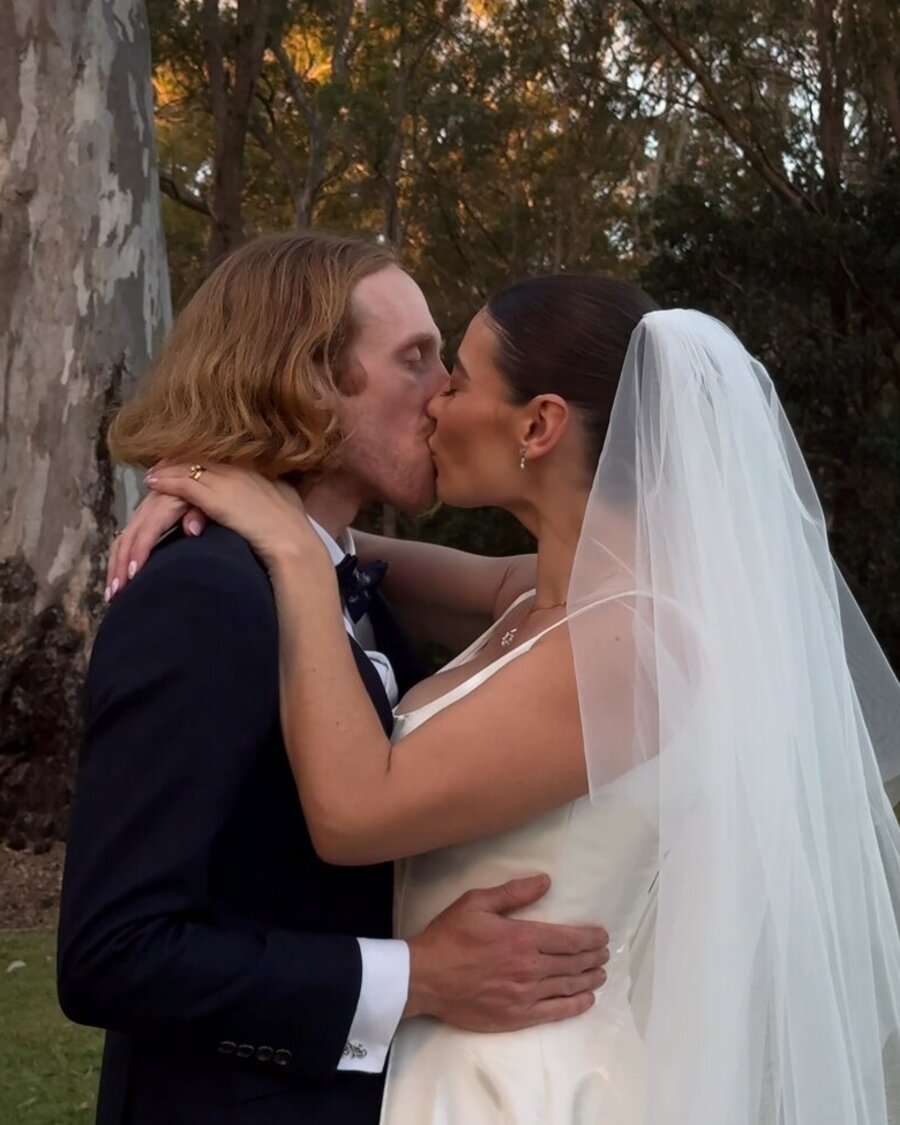 Wedding couple sharing a kiss
