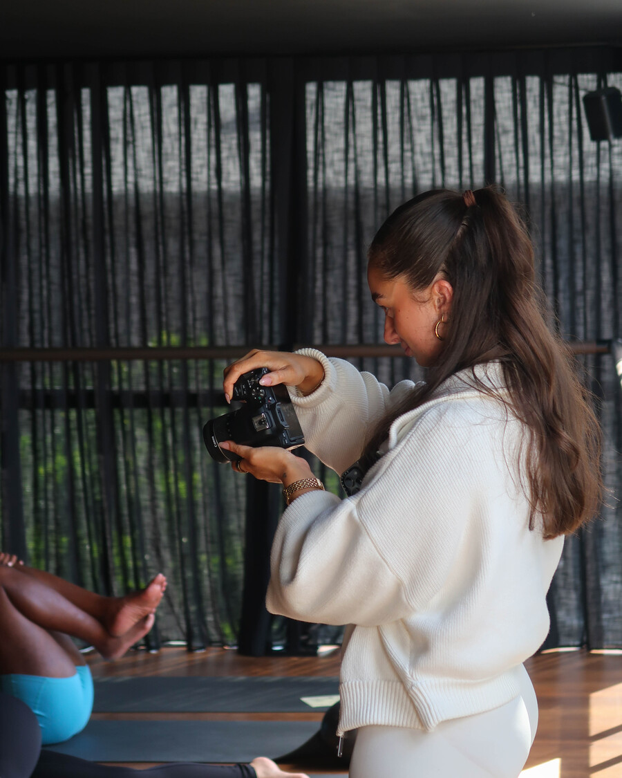 Behind-the-scenes filming a pilates class